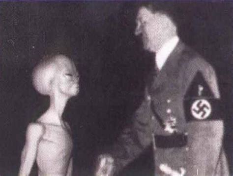 alien shaking hands with hitler